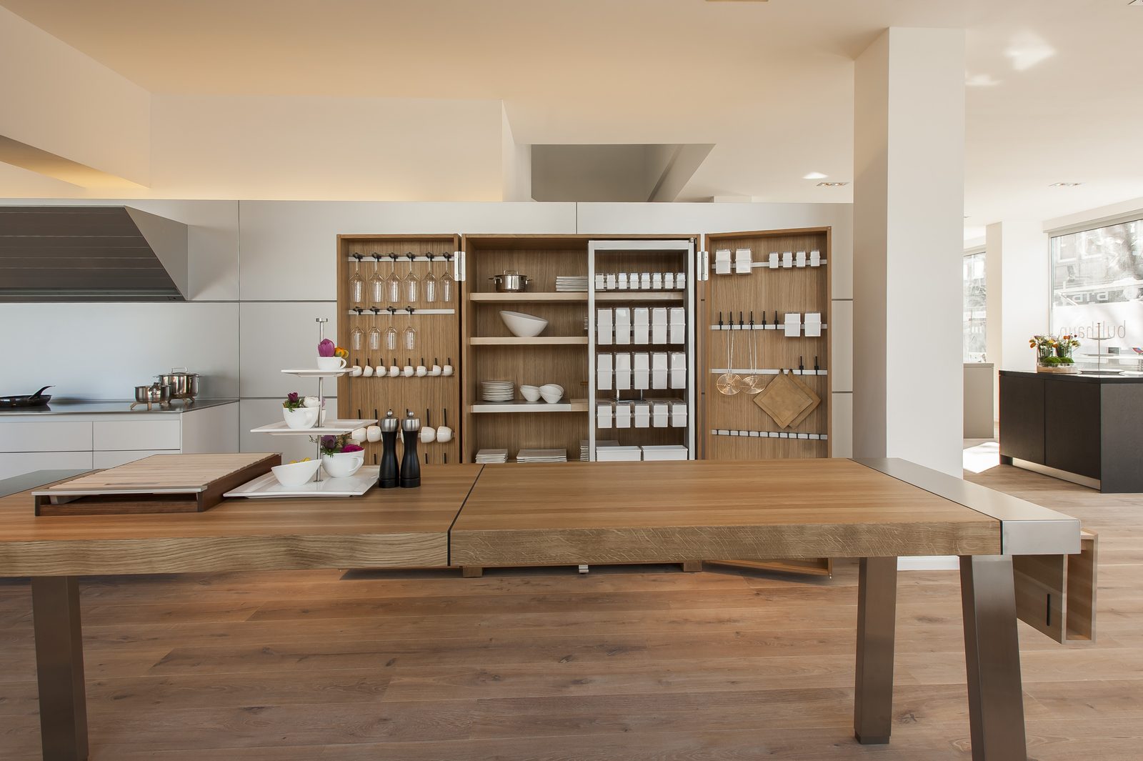 Showroom with oak storage wall and dining table